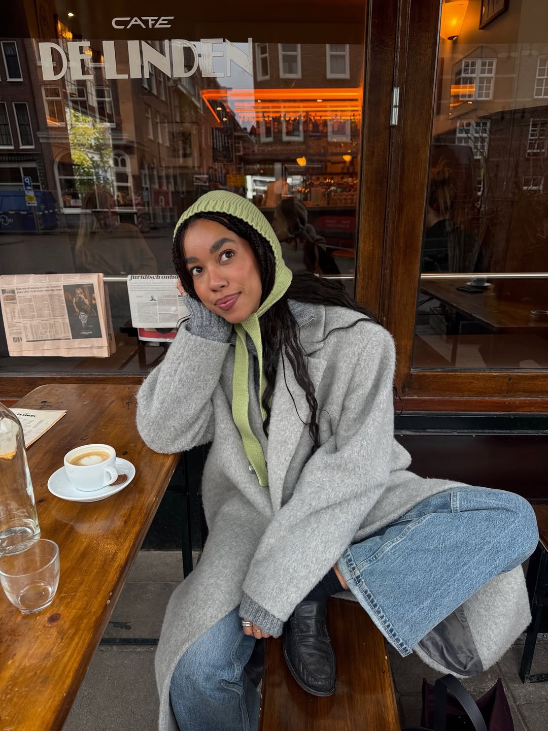 Amaka Hamelijnck poses with small knotless braids, mauve lips, and a glowing complexion