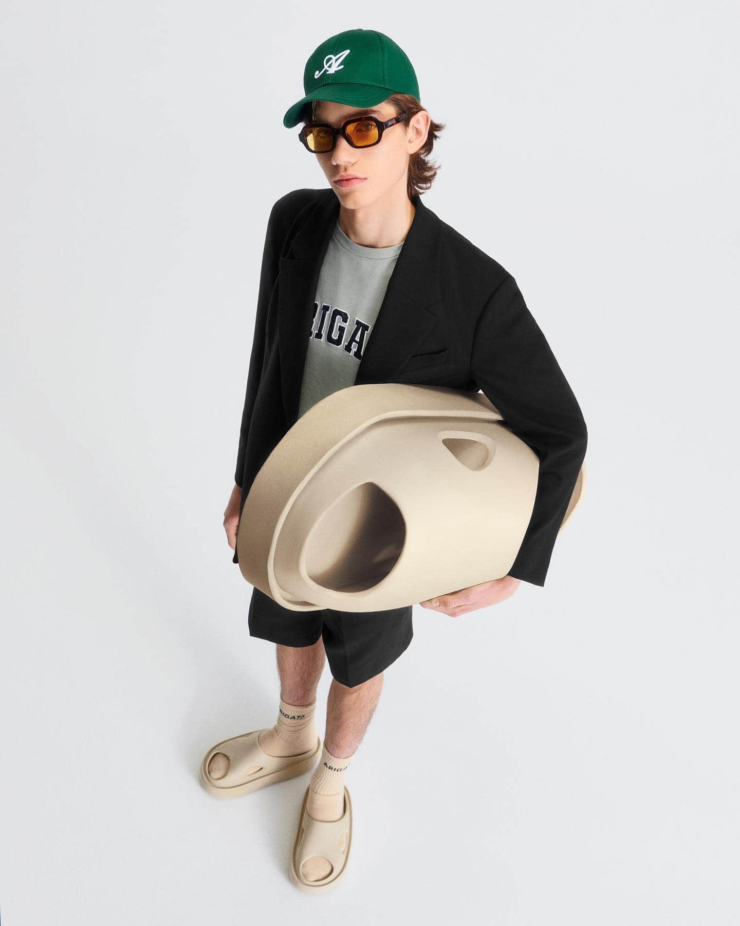 Man holding a big slide wearing athleisure outfits