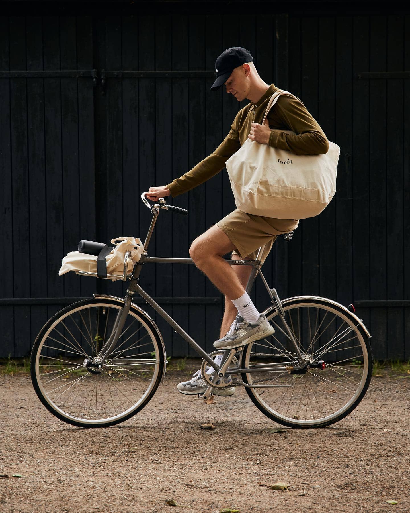 Man on a bike wearing athleisure merchandise from Foret