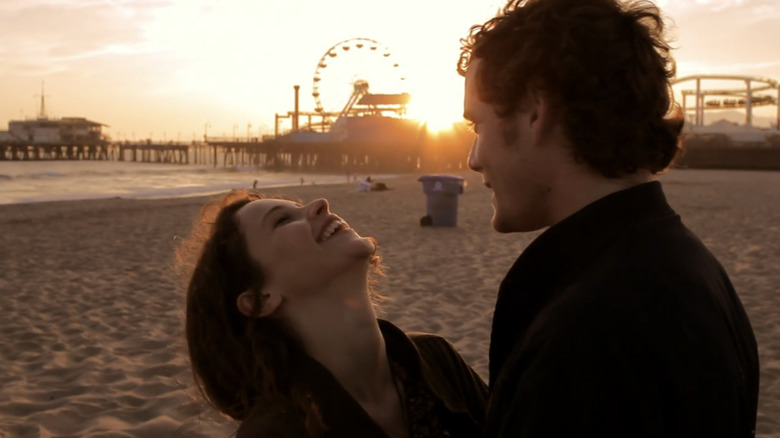 Anton Yelchin's Jacob Helm and Felicity Jones' Anna Gardner standing on a beach in Like Crazy