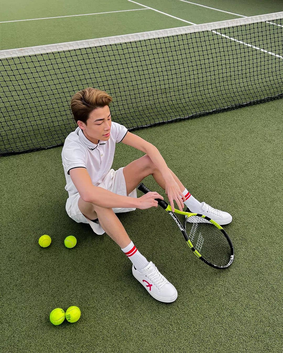 Man wearing athleisure outfit for playing tennis
