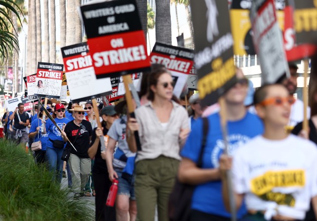 LOS ANGELES, CALIFORNIA - SEPTEMBER 22: Striking WGA (Writers Guild of America) members picket with striking SAG-AFTRA members outside Netflix studios on September 22, 2023 in Los Angeles, California. The Writers Guild of America and Alliance of Motion Picture and Television Producers (AMPTP) are reportedly meeting for a third straight day today in a new round of contract talks in the nearly five-months long writers strike.  (Photo by Mario Tama/Getty Images)
