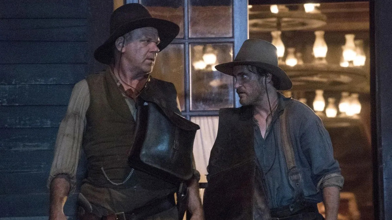 Eli and Charlie Sisters standing outside of a saloon