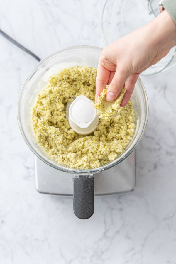 Pressing bits of shortcrust dough between fingers to test for doneness.