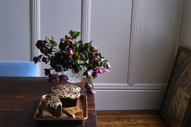 Pumpkin bread on a table with flowers