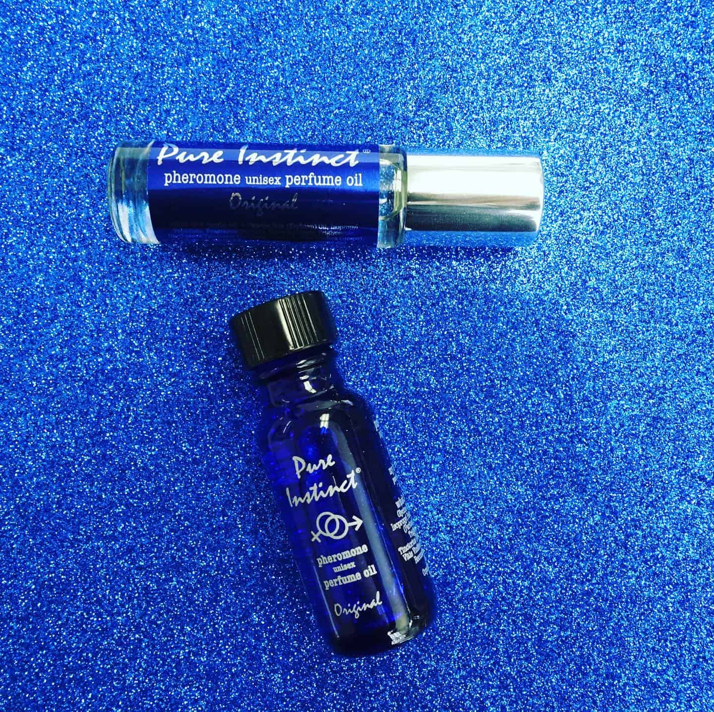 bottles of pure instinct unisex pheromone perfume