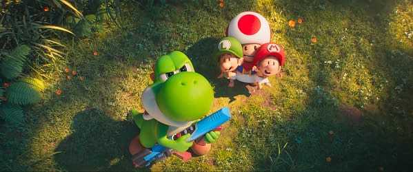 A colorful illustration featuring Yoshi, a green dinosaur, holding a blue weapon while looking confidently at the viewer. In the background, Mario, Luigi, and Toad are joyfully posing, set against a vibrant grassy landscape with flowers.