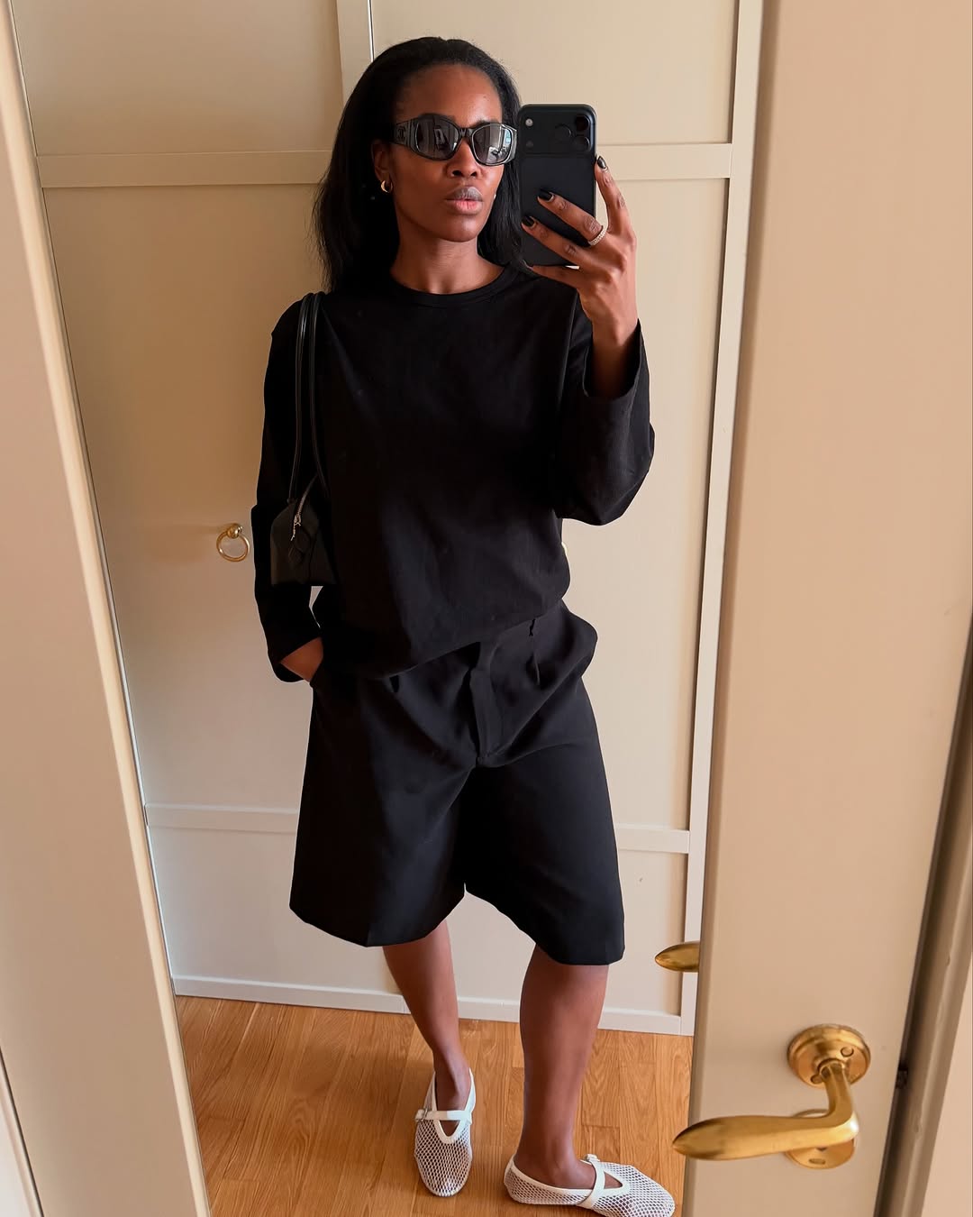 An image of a woman wearing white flats, shoe trend for spring 2026.