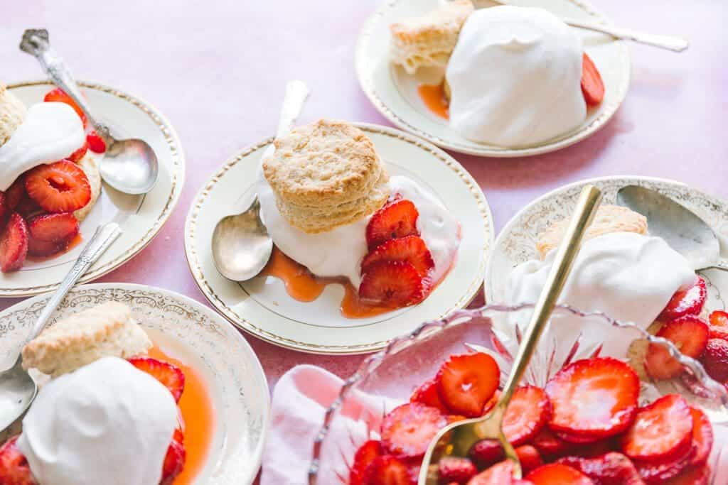 plates of strawberry shortcake with whipped cream