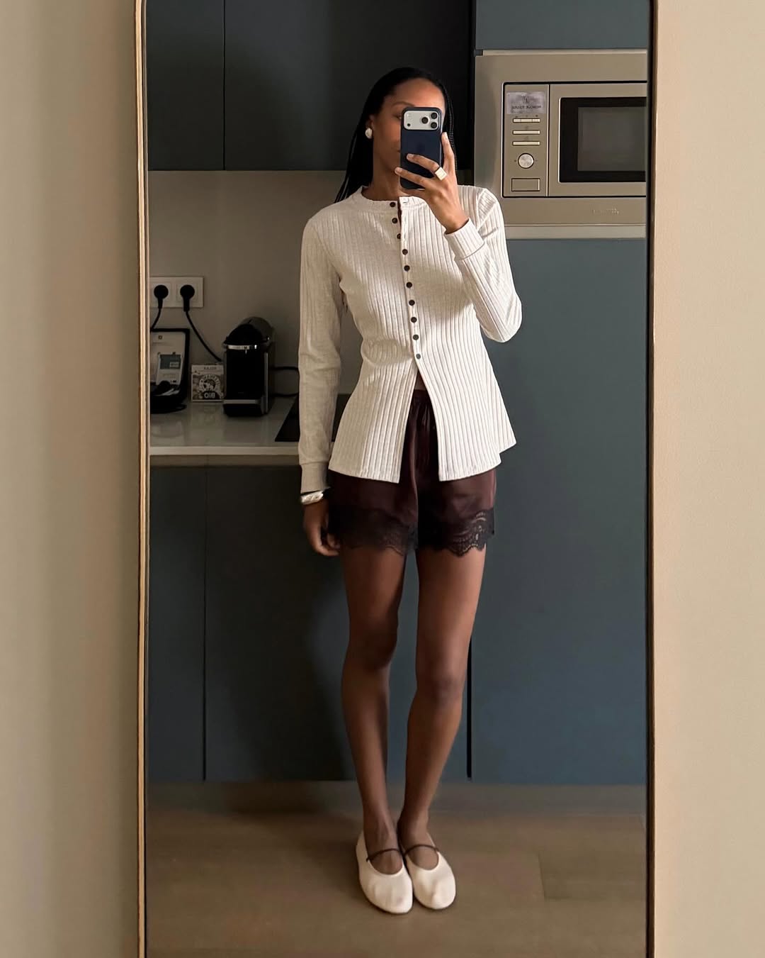 An image of a woman wearing white flats, shoe trend for spring 2026.