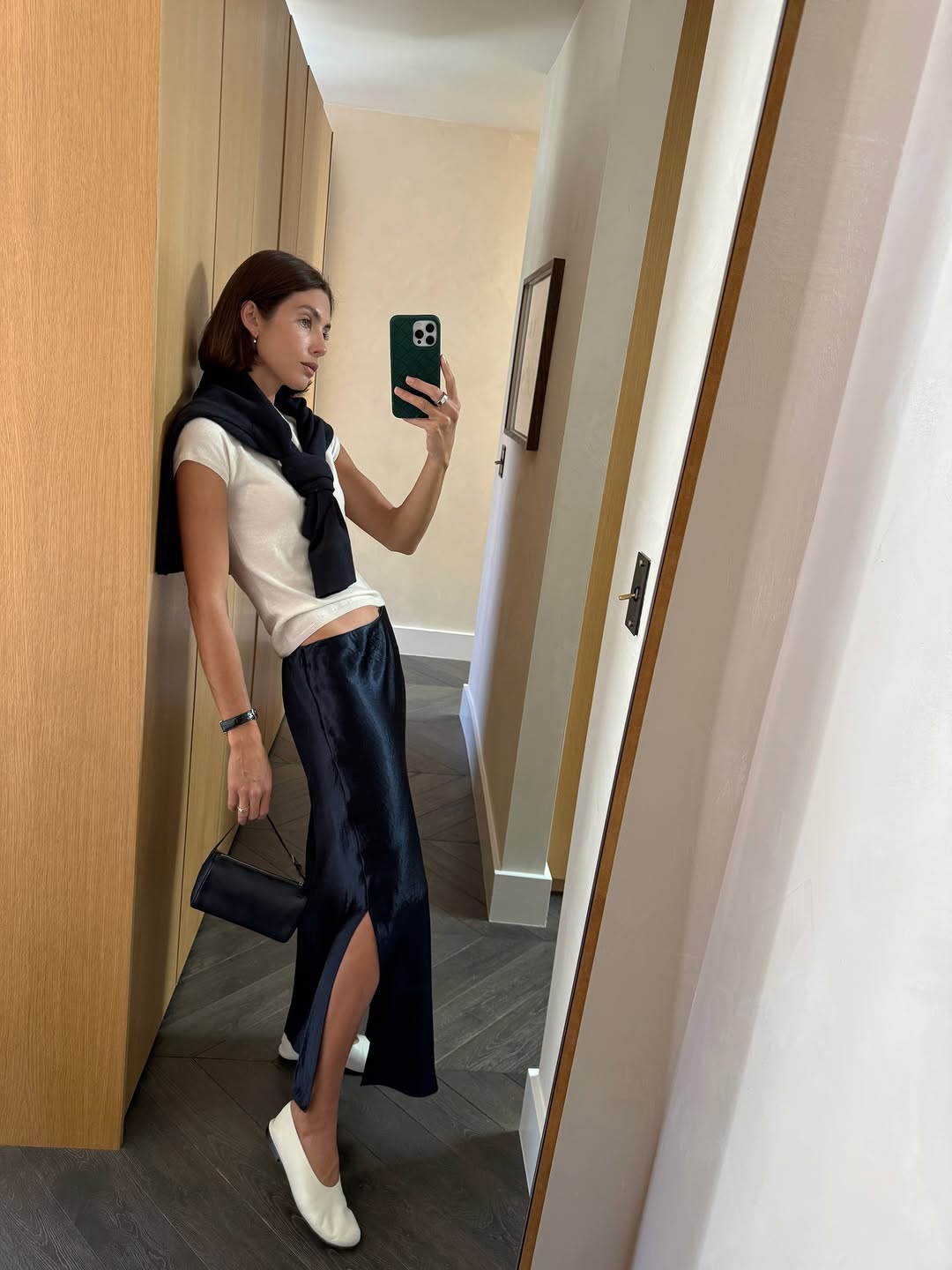 An image of a woman wearing white flats, shoe trend for spring 2026.