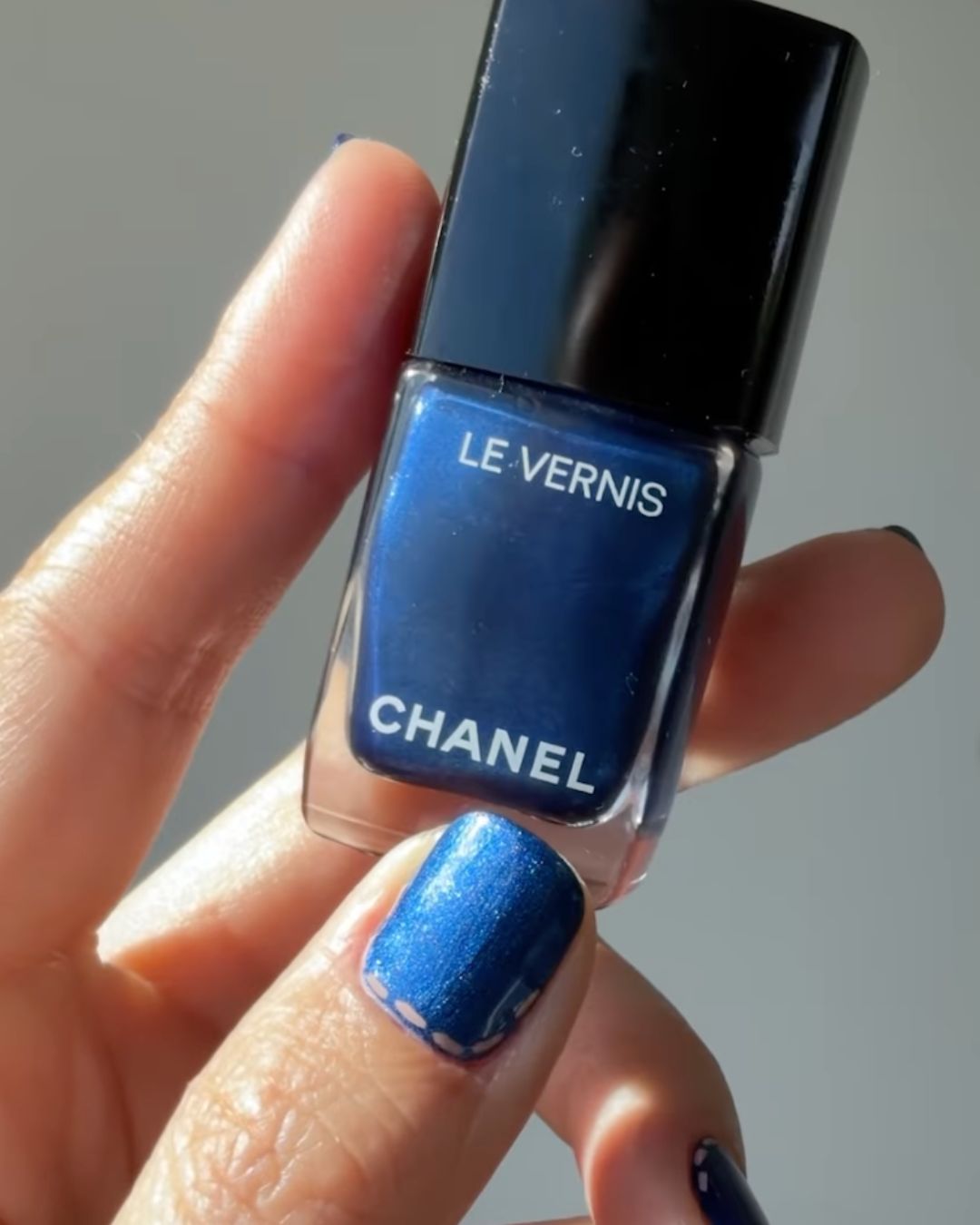 Denim nails with stitches.