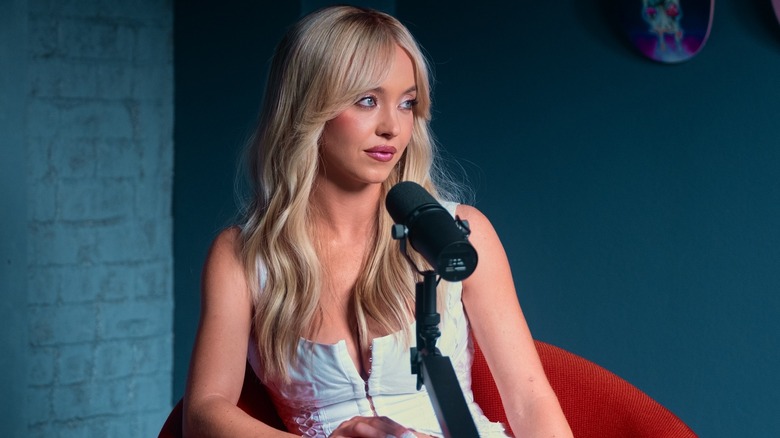 Cassie talking into a podcast mic on Euphoria