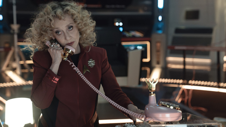 Pela on a corded telephone on Star Trek: Strange New Worlds