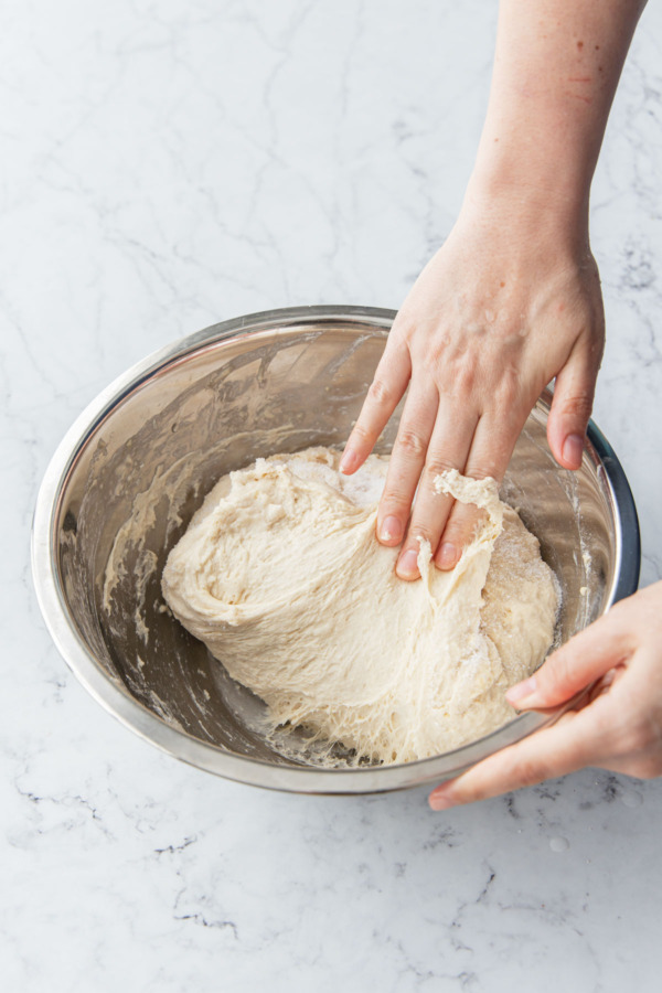 Folding the dough over itself to encase the salt inside.