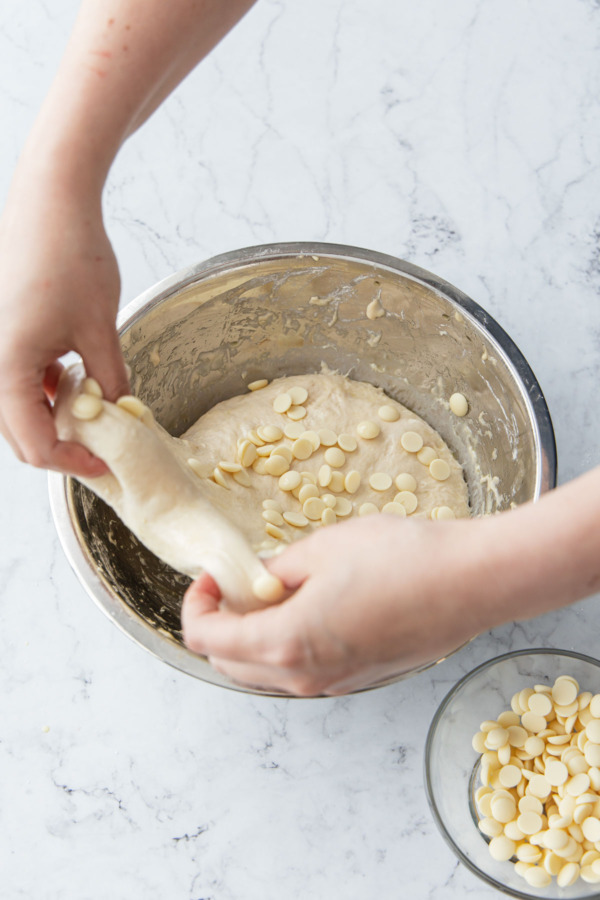 Stretching the dough up from the top of the bowl.