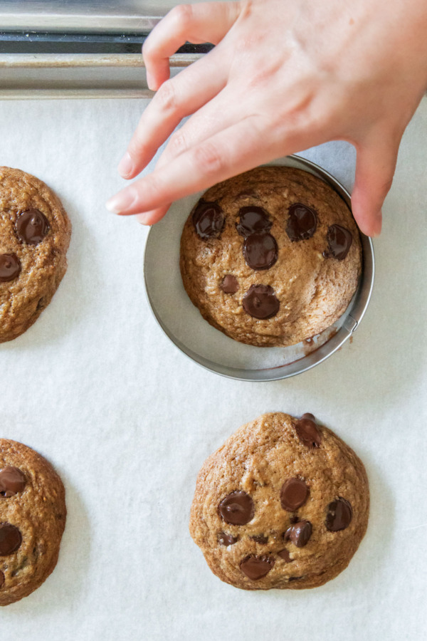 After baking, swirling a cookie cutter around the outside of the cookie to make perfect circles.