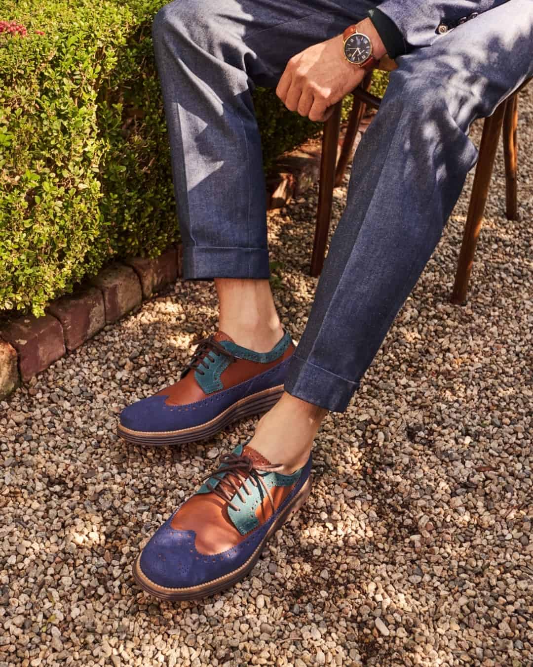 wearing a pair of brogue derby