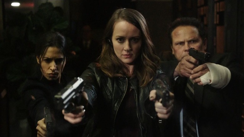 Root dual wielding guns while Shaw and Fusco back her up in Person of Interest